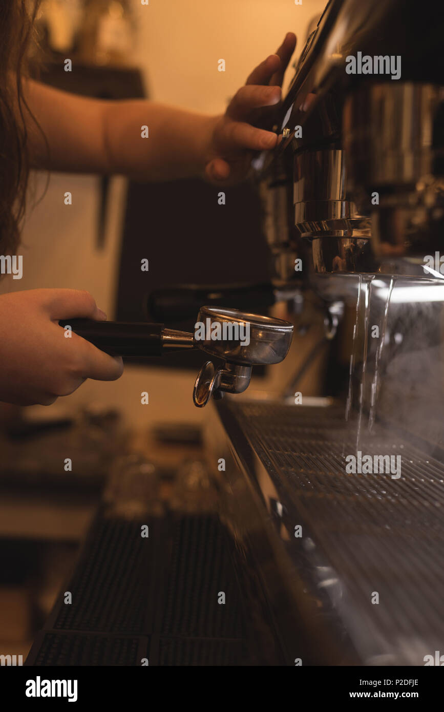 https://c8.alamy.com/comp/P2DFJE/barista-making-coffee-in-cafe-P2DFJE.jpg