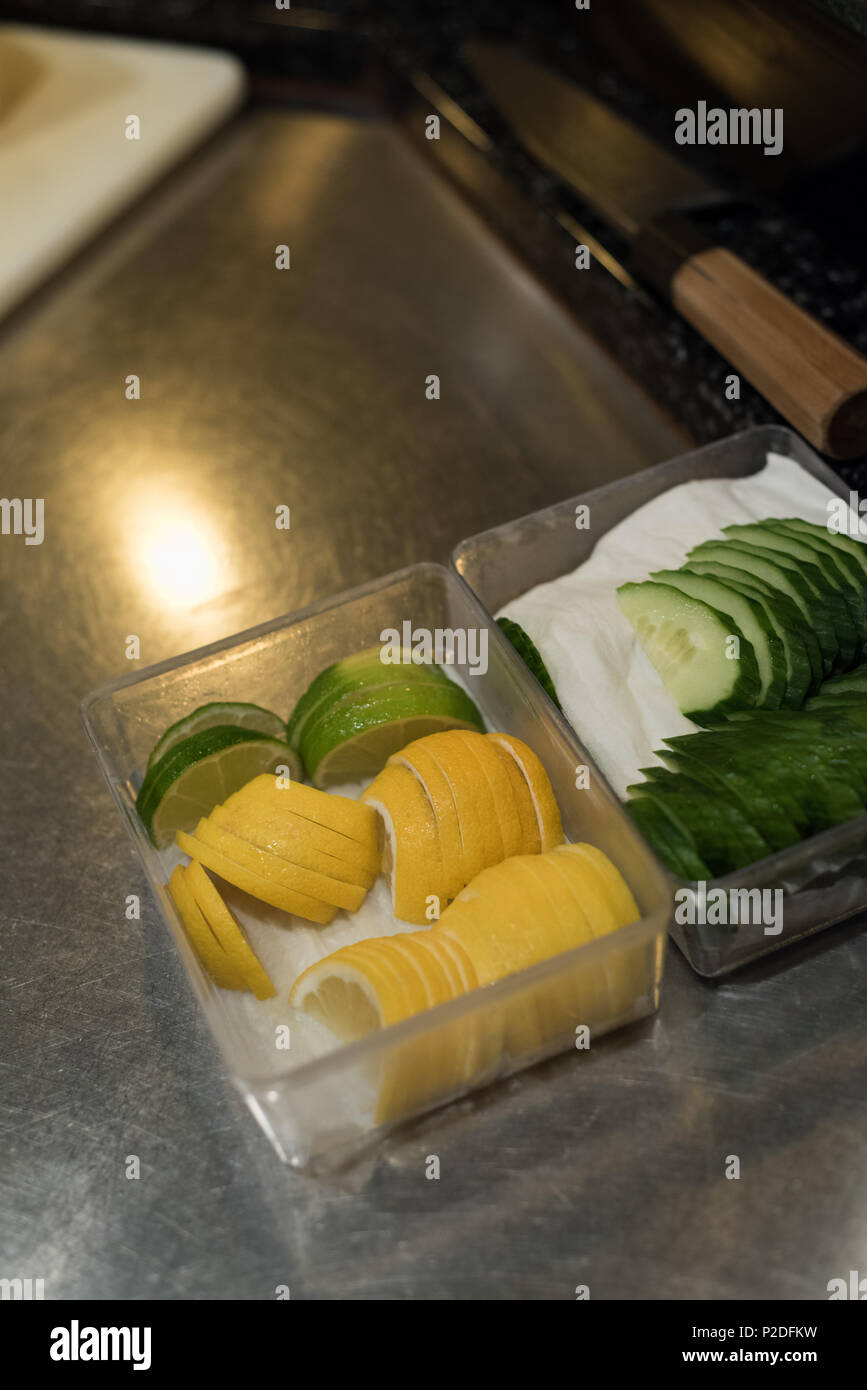 Sliced vegetables kept on kitchen counter Stock Photo