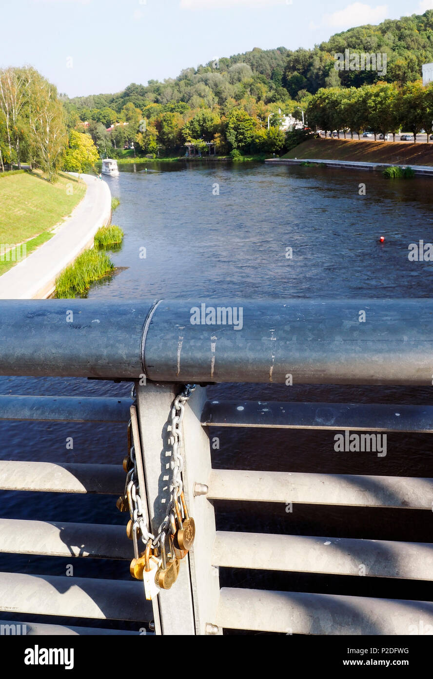Lithuania, Vilnius, Gediminas Hill, Neris River with locks and chain of love Mindaugas Bridge Stock Photo