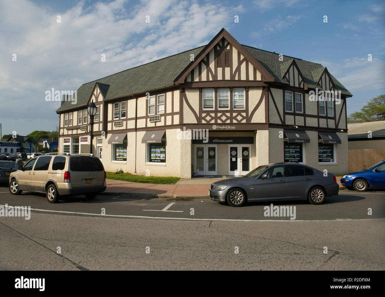 MONTAUK, NEW YORK-JUNE 8: English Tudor style architecture is seen on historic Fisher inspired building in village green downtown Montauk, New York, T Stock Photo
