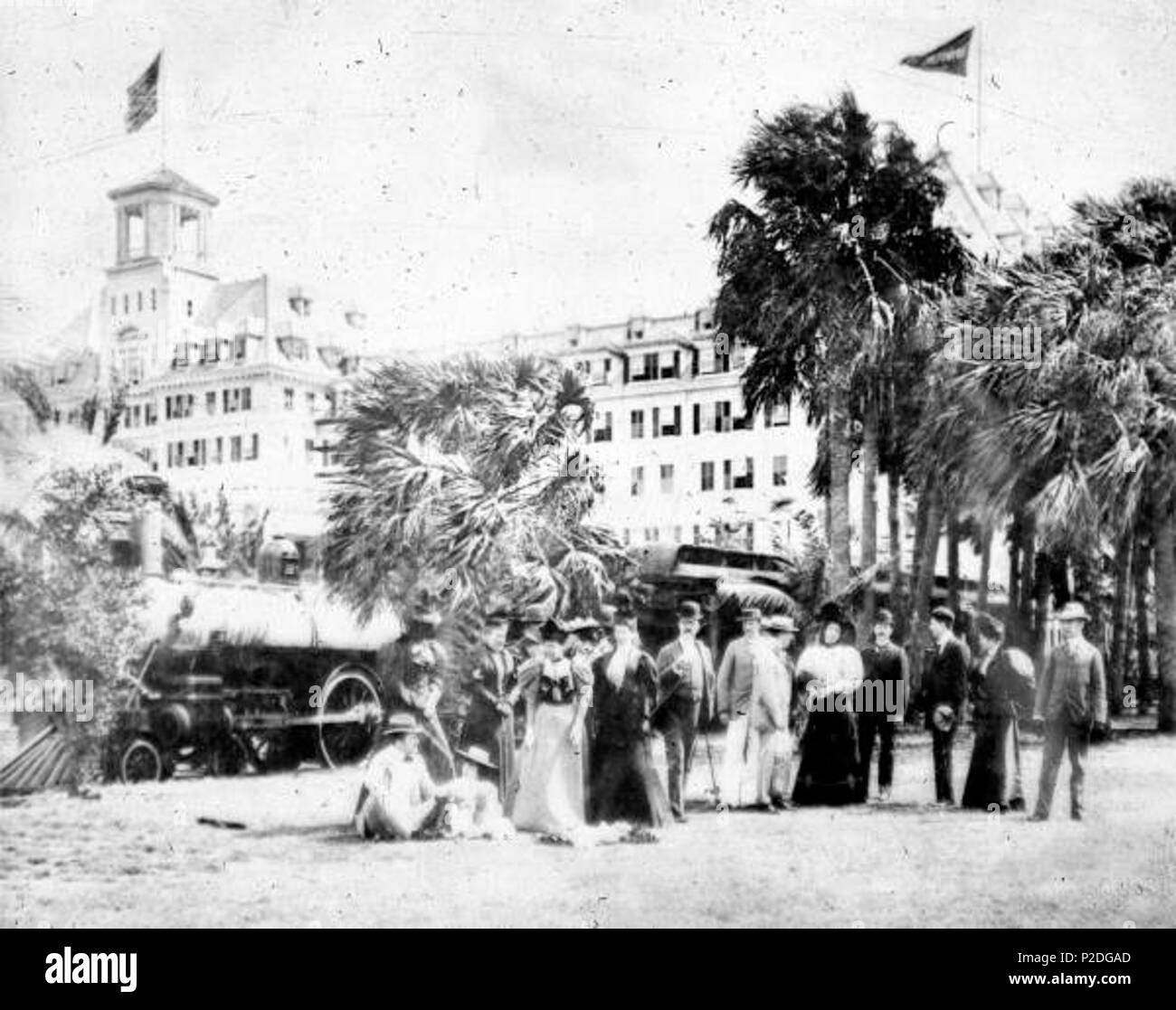 . English: Local call number: N036611 Title: Royal Poinciana guests standing beside the hotel train Date: March 14, 1896 Physical descrip: 1 photonegative; b&w; 4 x 5 in. Series Title: General collection General note: Left to Right: Colonel Philip M. Lydig, Miss Helen Morton, Miss Gladys Vanderbilt, Miss Amy Townsend, Captain A.T. Rose, Mrs. Cornelius Vanderbilt, Miss Edith Bishop, Miss Mabel Gerry, Thomas Cushing, Edward Livingston, Dudley Winthrop, Craig Wadsworth, Miss Gertrude Vanderbilt, Lispenard Stewart, Harry P. Whitney, Miss Sybil Sherman, Cornelius Vanderbilt. Repository: State Libra Stock Photo