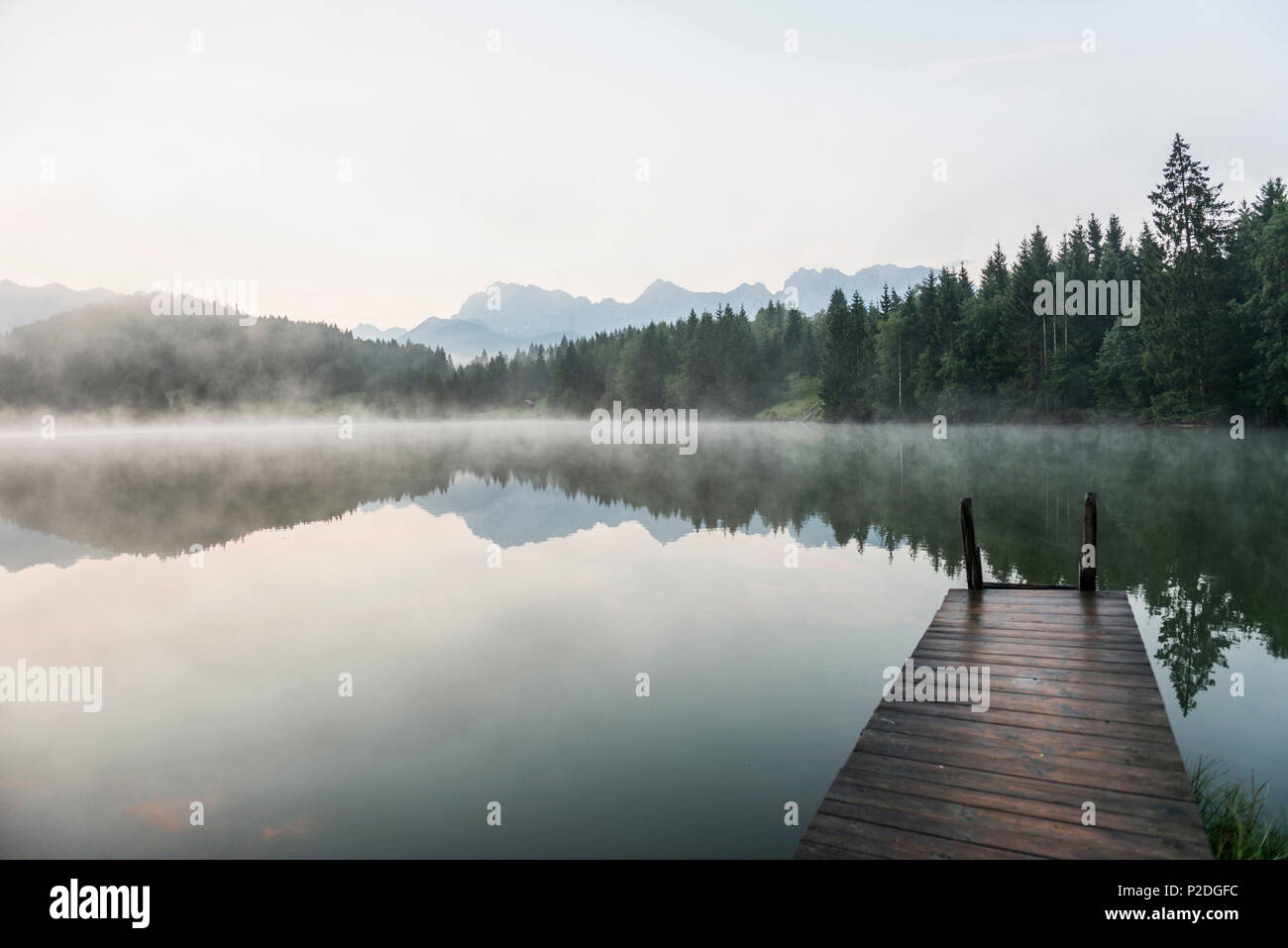 Lake Geroldsee with reflection, Wagenbruechsee, Kruen, near Garmisch-Partenkirchen, Upper Bavaria, Bavaria, Germany Stock Photo