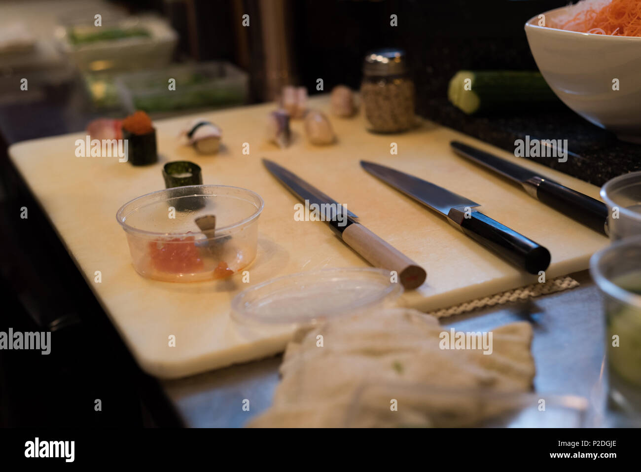 Japanese deba knives kept on kitchen table Stock Photo