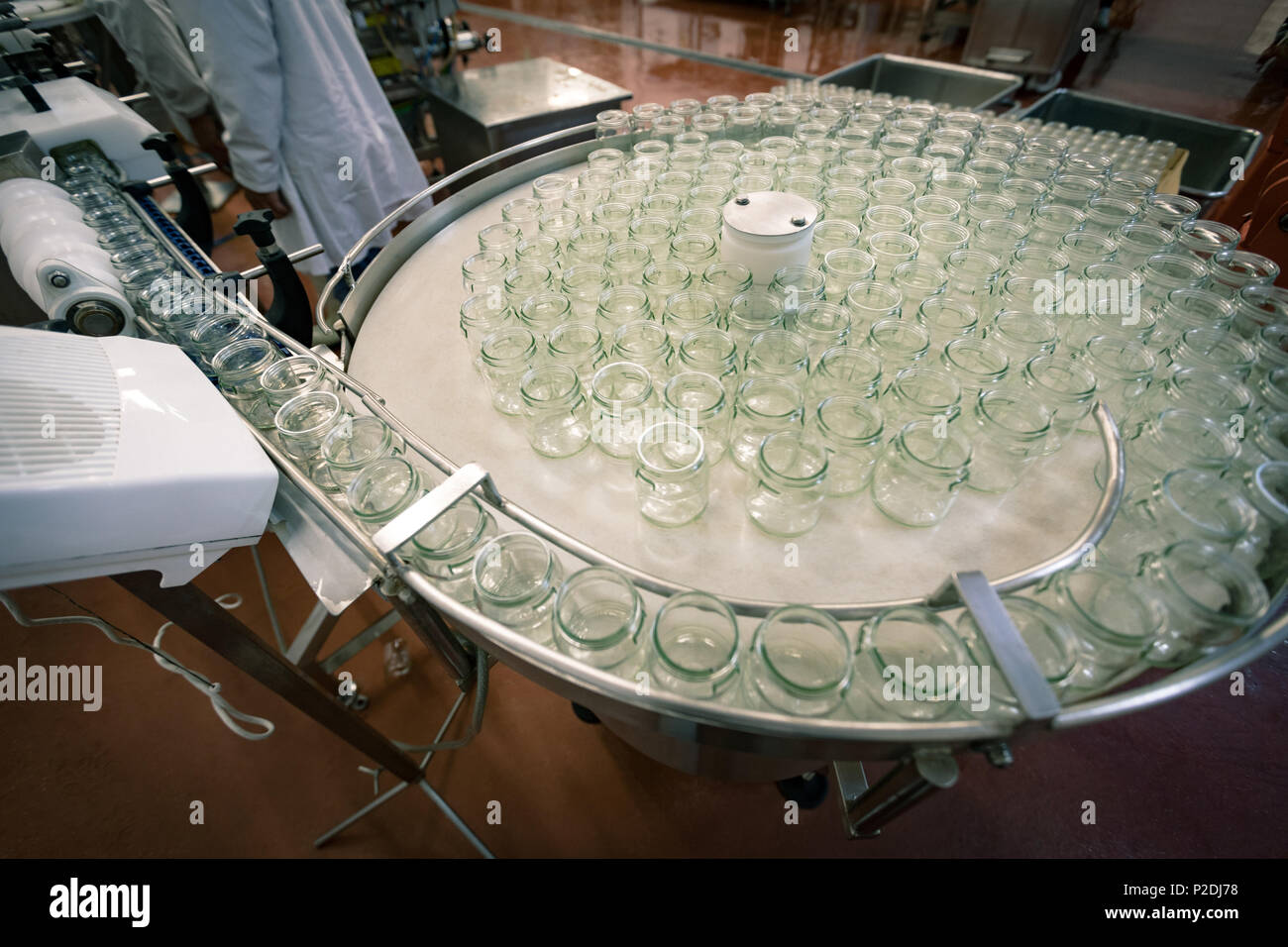 Empty glass jars on production line Stock Photo
