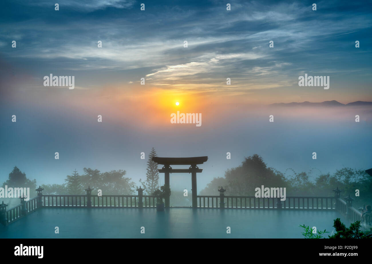 The magical dawn on the pagoda, surrounded by dew and magical light from the beautiful sun to meditate and relax the soul Stock Photo