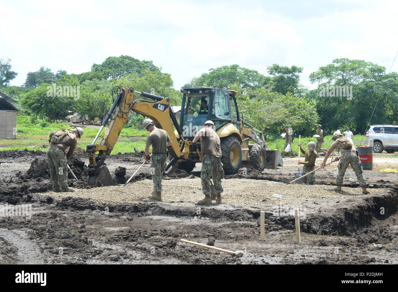 {160908-N-VC432-085} CARTAGENA, Colombia (Sep. 8, 2016)- SeaBees, assigned to Naval Mobile Construction Battalion133 (NMCB 133), compact and level gravel in preparation of pouring the foundation of a new latrine for the Cabildo Indigena Zenu community during Southern Partnership Station 2016 (SPS-16).  SPS-16 is an annual series of U.S. Navy deployments, fostering a lasting relationship with the people of Central and South America through exercises, operations and community relation projects. (U.S. Navy photo by Mass Communication Specialist 1st Class Kimberly Clifford/Released) Stock Photo