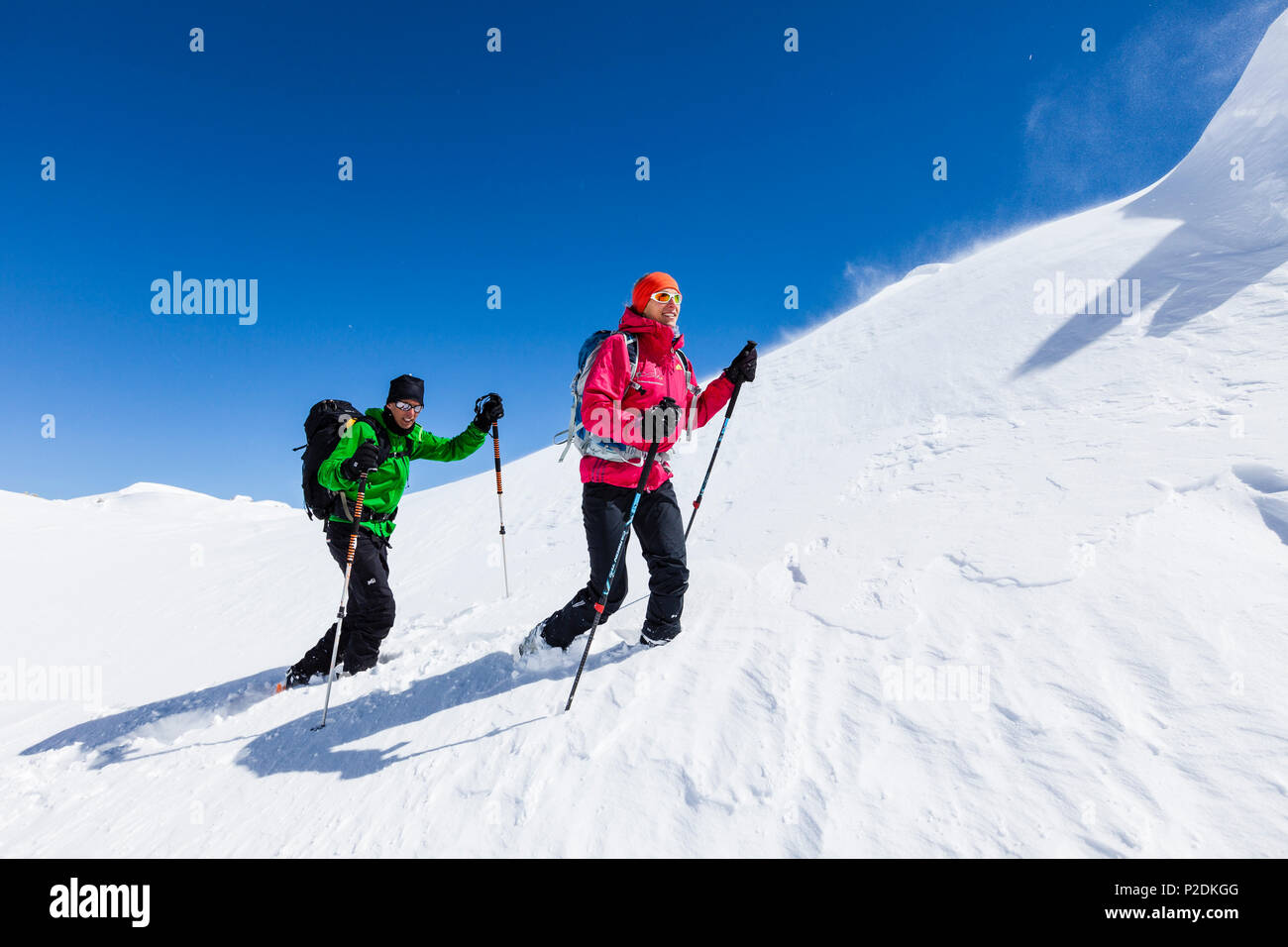 Young couple mountain climbing in Winter, Hochwannig, Mieminger Berge, Ehrwald Tirol, Austria Stock Photo