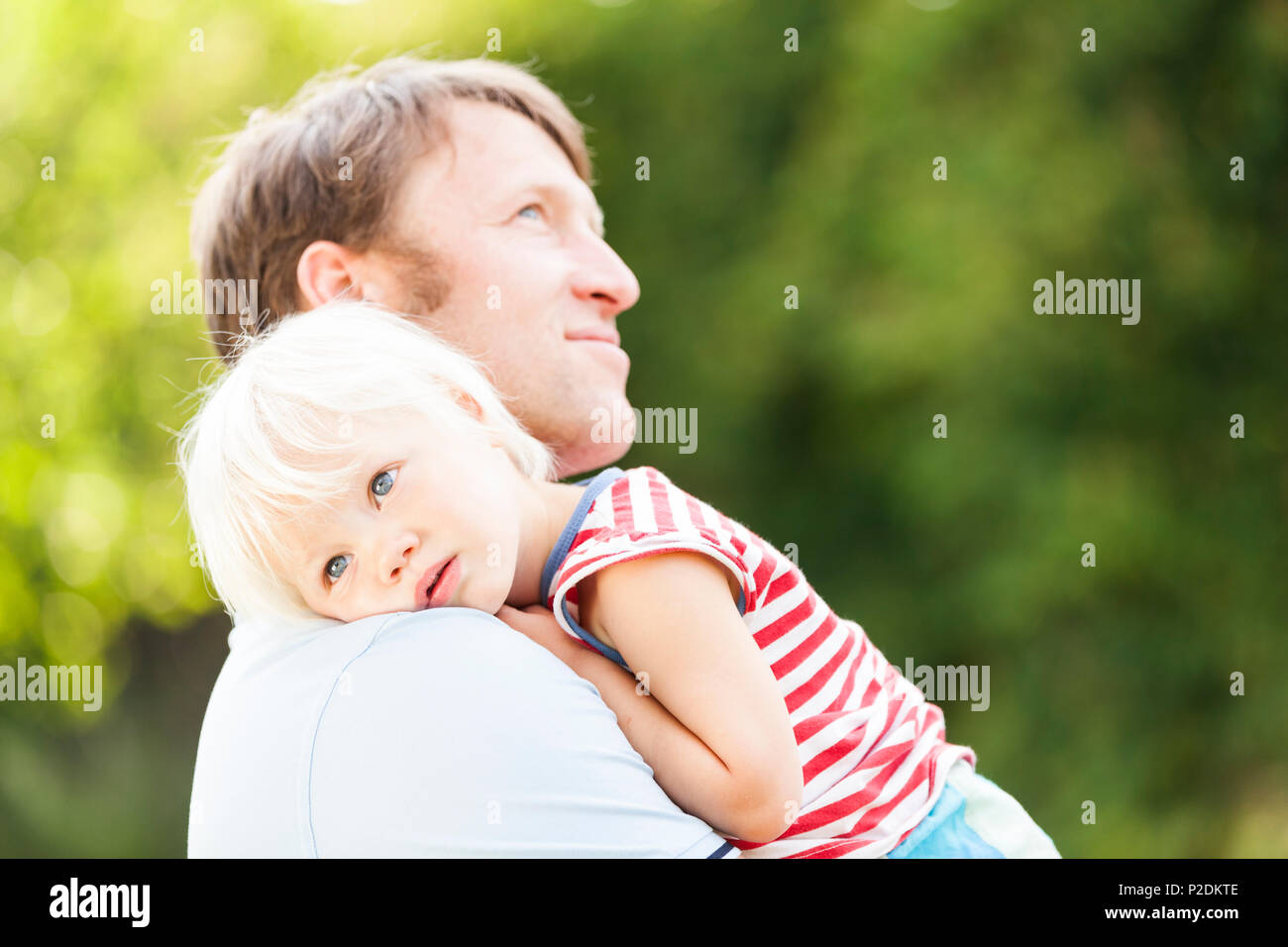 Two-year-old girl in her father's arms, Speyer, Rheinland-Pfalz, Germany Stock Photo