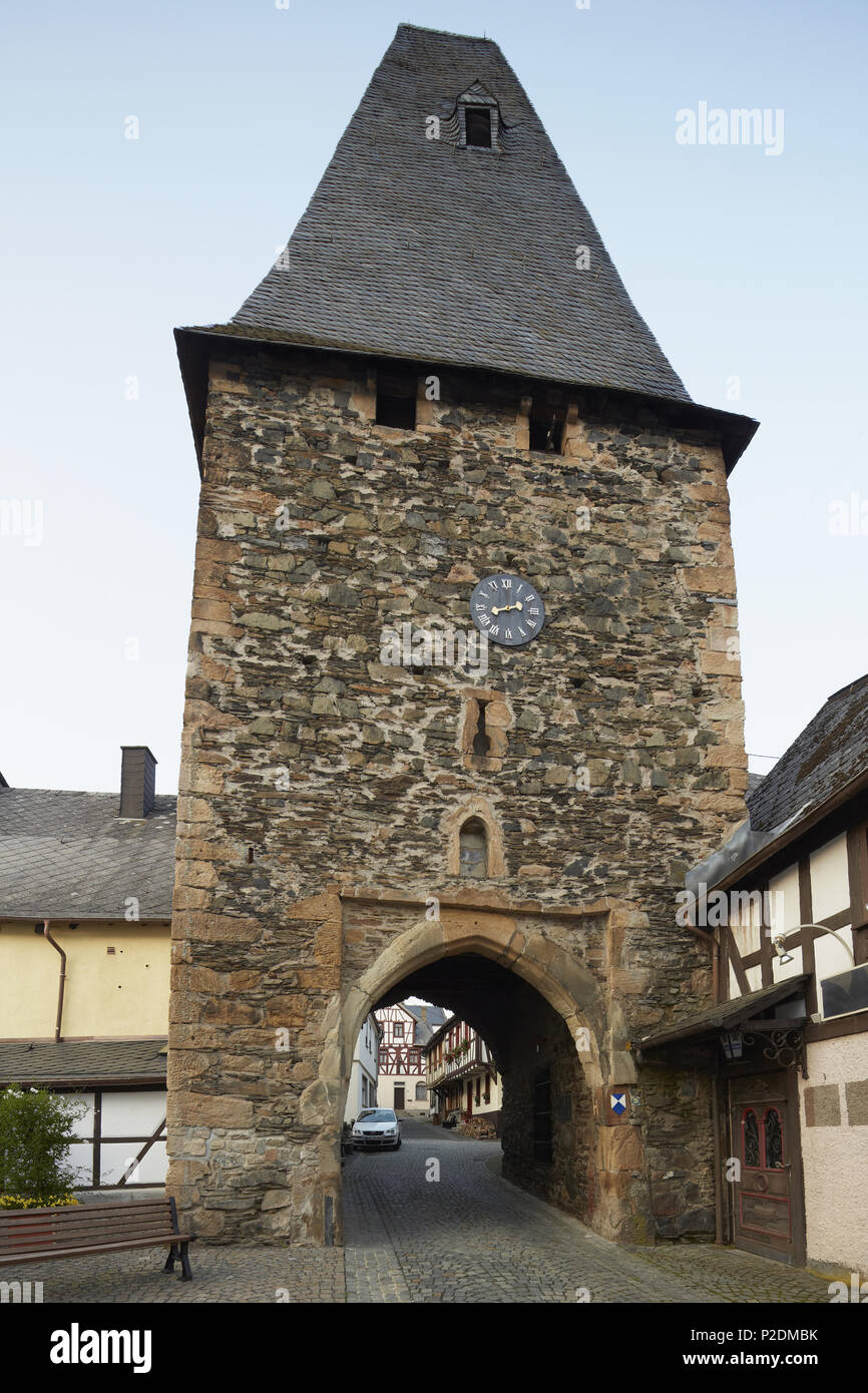 Half-timbered houses and gateway of the 12th century clock tower in Herrstein, Administrative district of Birkenfeld, Region of Stock Photo