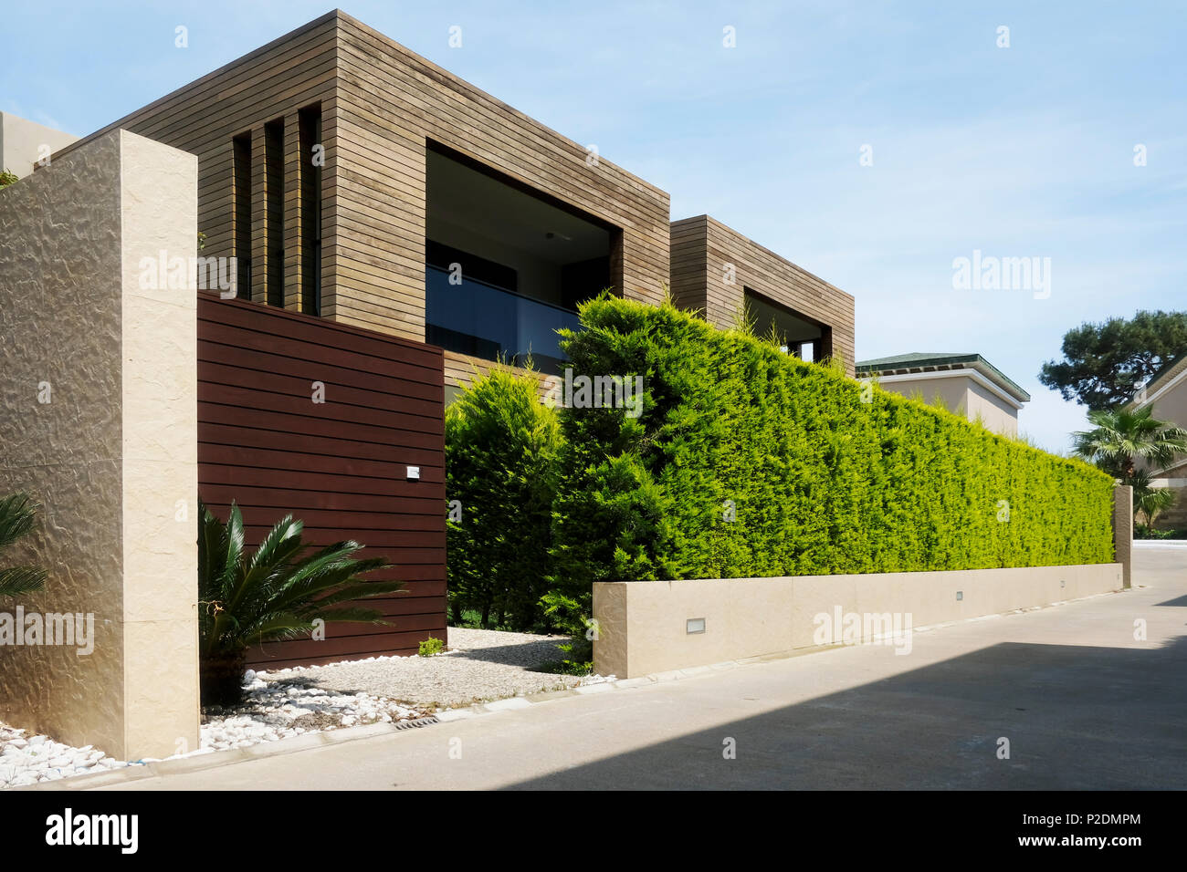 Modern houses with green plant wall Stock Photo