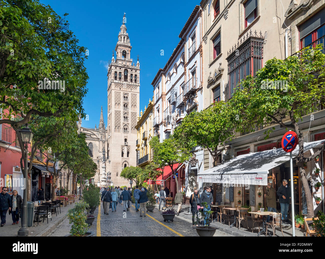 Seville, Spain. Cafes on Calle Mateos Gago looking towards the Giralda tower and Cathedral, Sevilla, Spain Stock Photo