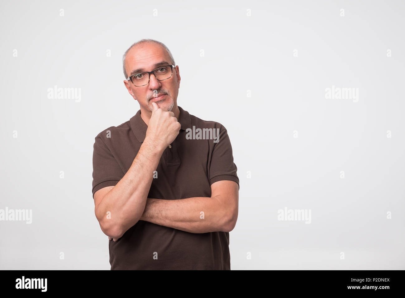 Seniors portrait of contemplative old caucasian man looking at camera. Copy space Stock Photo