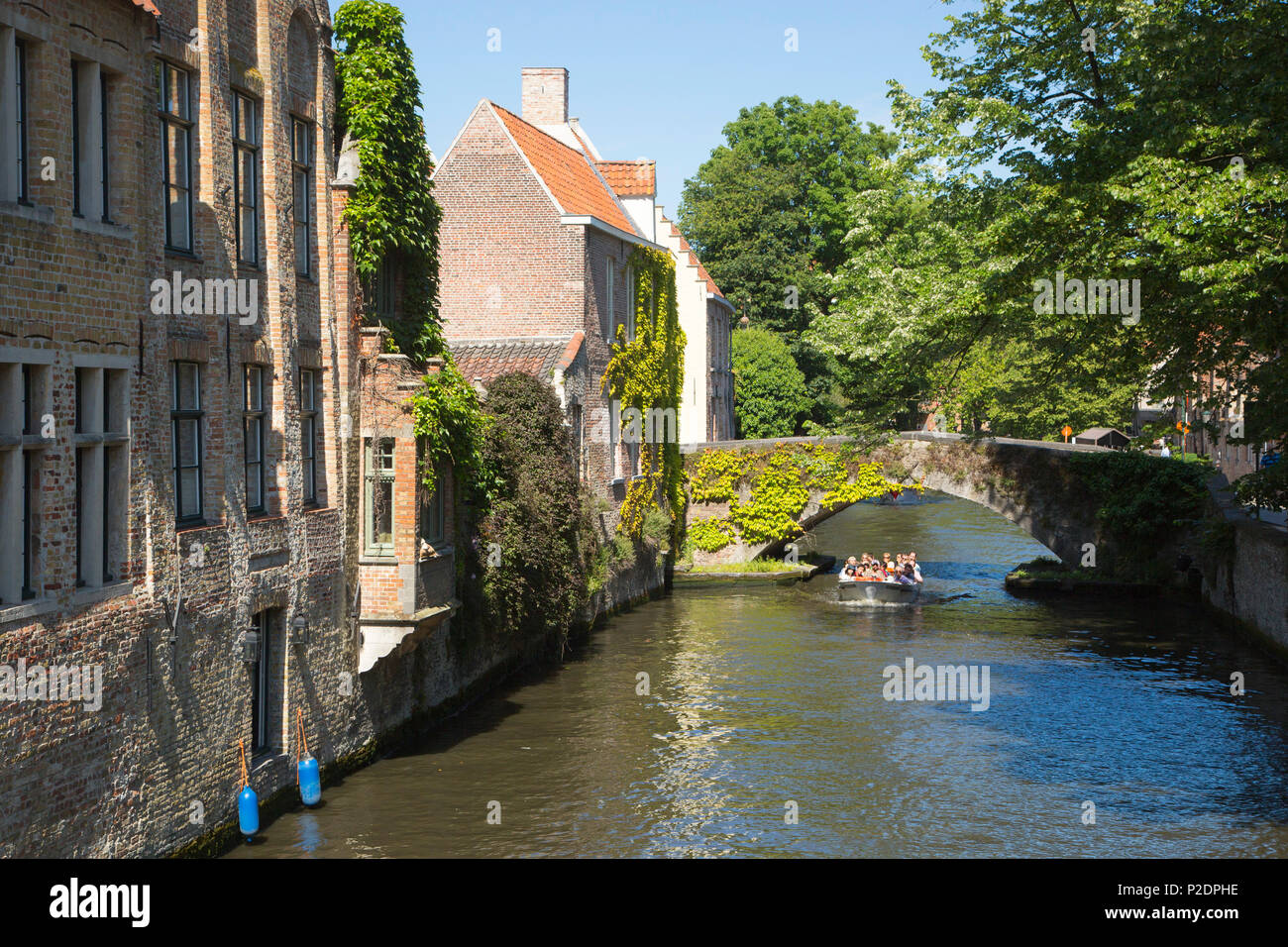 Sightseeing boat on the canal in the Old Town, Bruges Brugge, Flemish Region, Belgium Stock Photo
