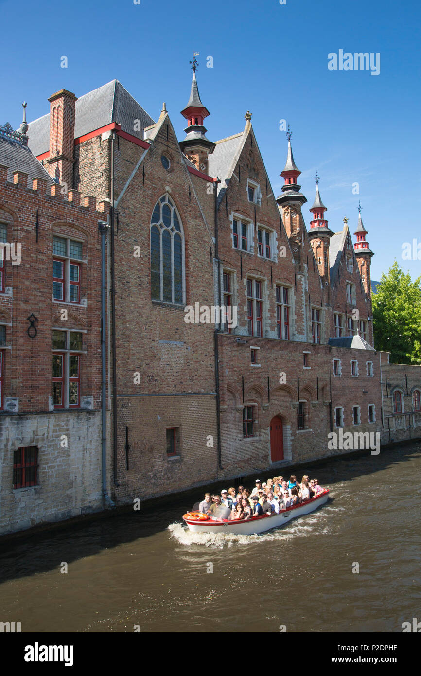 Sightseeing boat on the canal in the old Town, Bruges Brugge, Flemish Region, Belgium Stock Photo