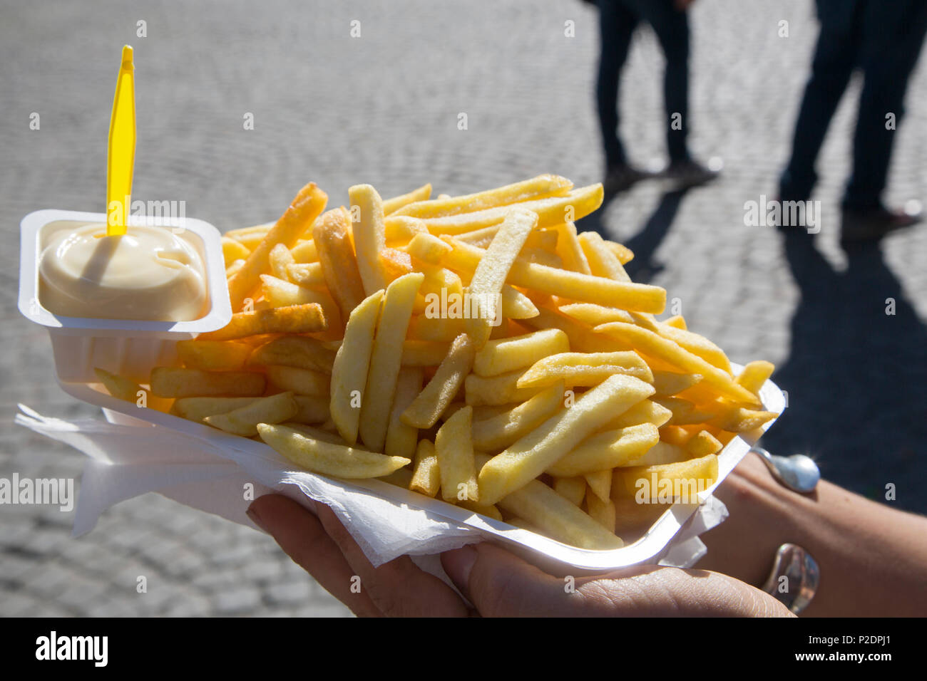Delicious chips, pommes frites with mayonnaise from Friteri 1999 snack shop on Grote market square in the old town, Bruges Brugg Stock Photo