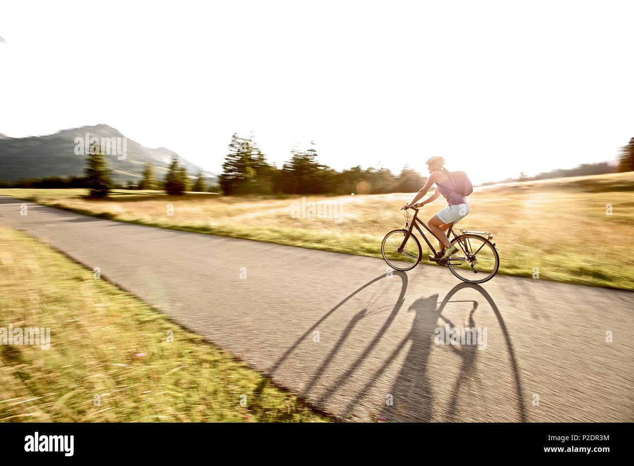 Woman riding bike back view hires stock photography and images Alamy
