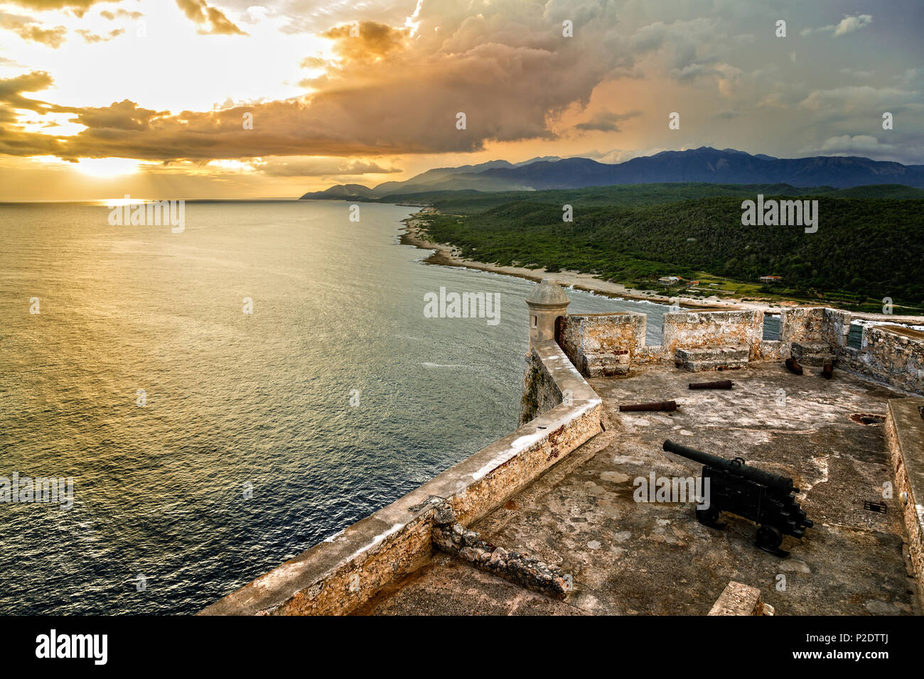 San Pedro de La Roca fort walls with canon, Carribean sea sunset view, Santiago De Cuba, Cuba Stock Photo