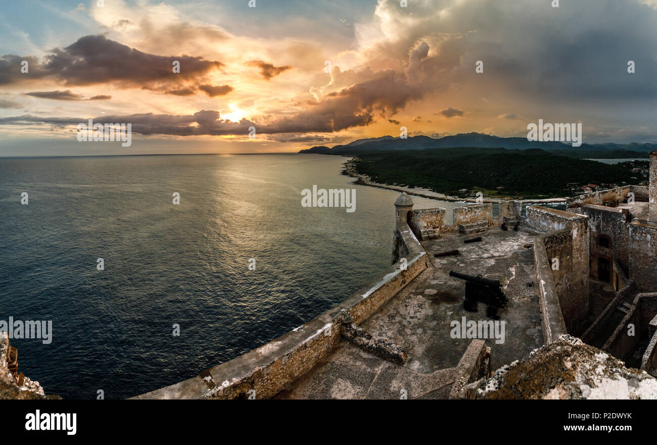 San Pedro de La Roca fort walls with canon, Carribean sea sunset view, Santiago De Cuba, Cuba Stock Photo