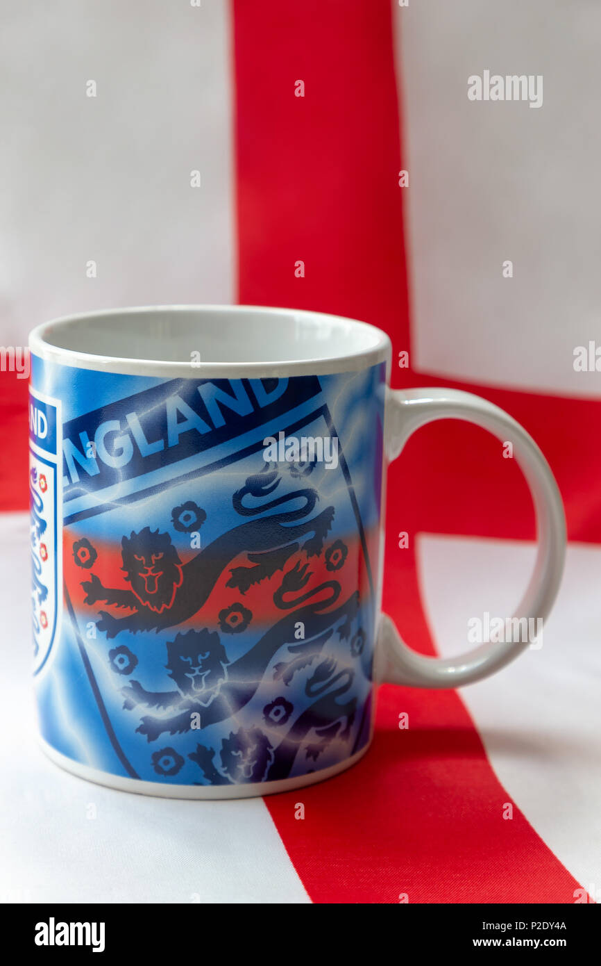 14 June 2018 - Drinking mug bearing the Three Lions badge sitting on an English flag prior to The 2018 FIFA World Cup International Football Tournamen Stock Photo