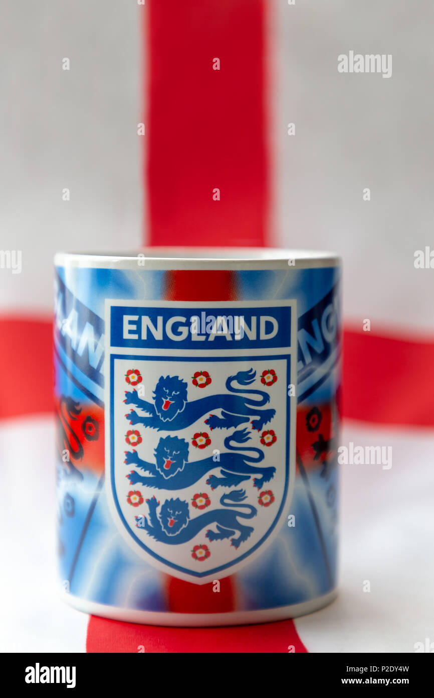 14 June 2018 - Drinking mug bearing the Three Lions badge sitting on an English flag prior to The 2018 FIFA World Cup International Football Tournamen Stock Photo