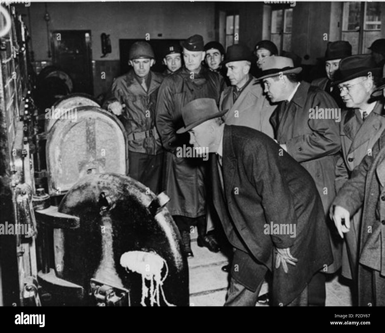 . English: American congressmen view the open ovens in the Buchenwald crematorium during an inspection of the newly liberated concentration camp. Pictured from left to right are: Senator Alben W. Barkely (D.Ky), Representative Edward V. Isac (D.CA.), Representative John M. Vorys (R. OH.), Representative Dewey Short (R. MO.), Senator C. Wayland Brooks, (R. IL.), and Senator Kenneth S. Wherry (R. NB). 24 April 1945 10 Buchenwald Congressmen Crematoria 37265 Stock Photo