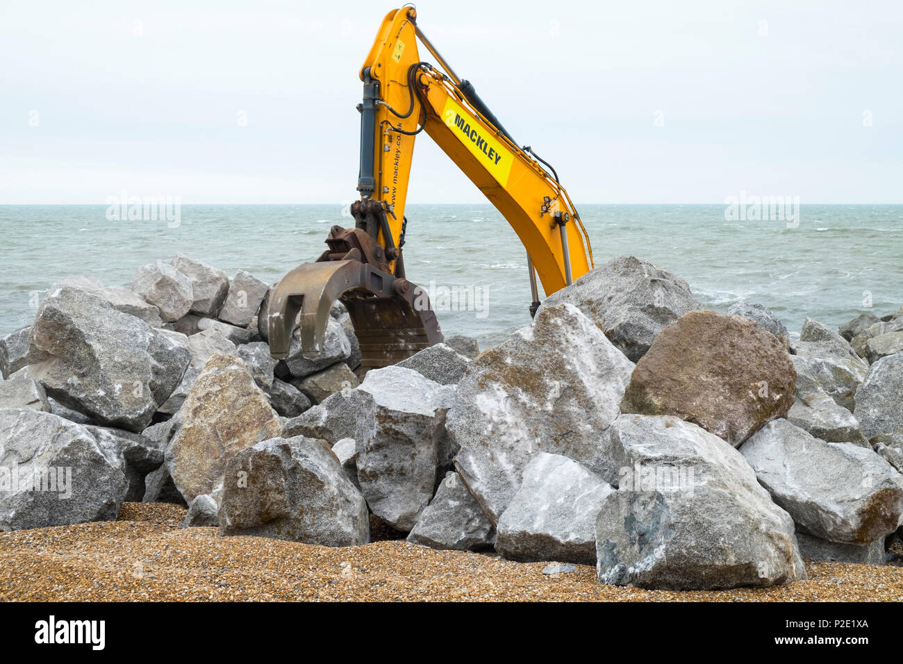 Stockpiling of 6-9 tonne rock for the Hastings coast protection works, harbour arm, hastings, east sussex, uk Stock Photo