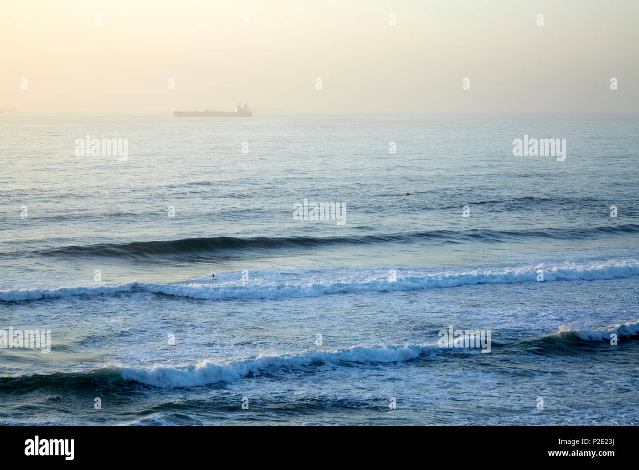 Ocean with tanker in mist at Umhlanga Rocks, Umhlanga, South Africa Stock Photo