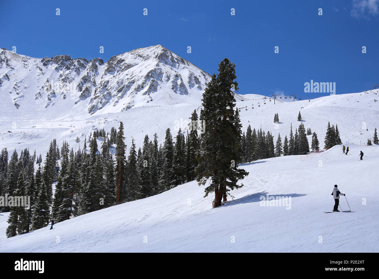 People skiing at Arapahoe Basin Ski Resort in the Colorado Rocky Mountains Stock Photo