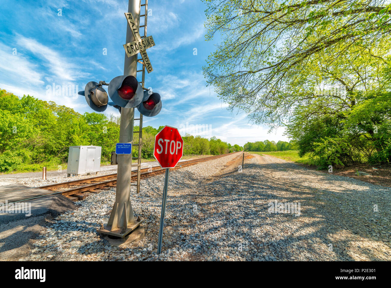 Horizontal shot of railroad crossing warning equipment and a stop sign Stock Photo Alamy