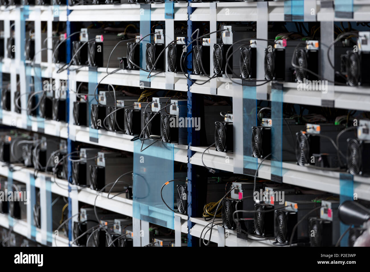 shelves with equipment for bitcoin mining farm Stock Photo - Alamy