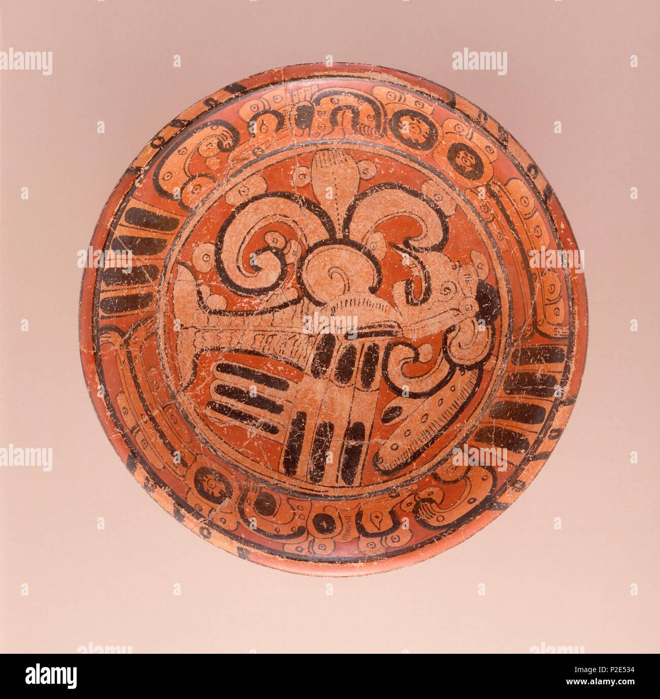 English: Mexico, Northern Campeche, Maya Tripod Plate with Mythological  Bird, A.D. 550-700 Ceramic, Slip-painted ceramic, Diameter: 14 in. (35.6  cm) Gift of the Art Museum Council in honor of the museum's