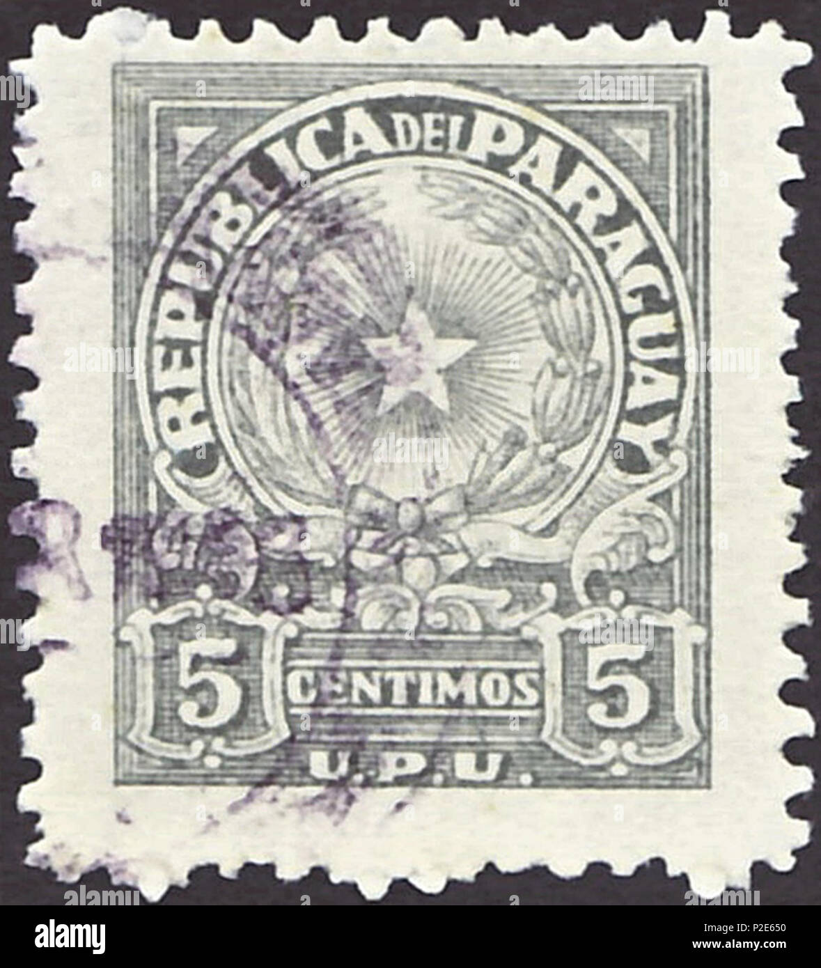 . Stamp of Paraguay; 1946; definitive stamps in the drawing 'Star in coat of arms' with U.P.U. inscribed below; postmarked Stamp: Michel: No. 596 Color: grey Watermark: none Nominal value: 5 Centimos Stamp picture size: 19.5 x 24.0 mm . 1946 (first issue of the stamp). Correo Paraguayo (Post of Paraguay) 39 PAR 1946 MiNr0596 pm B002 Stock Photo