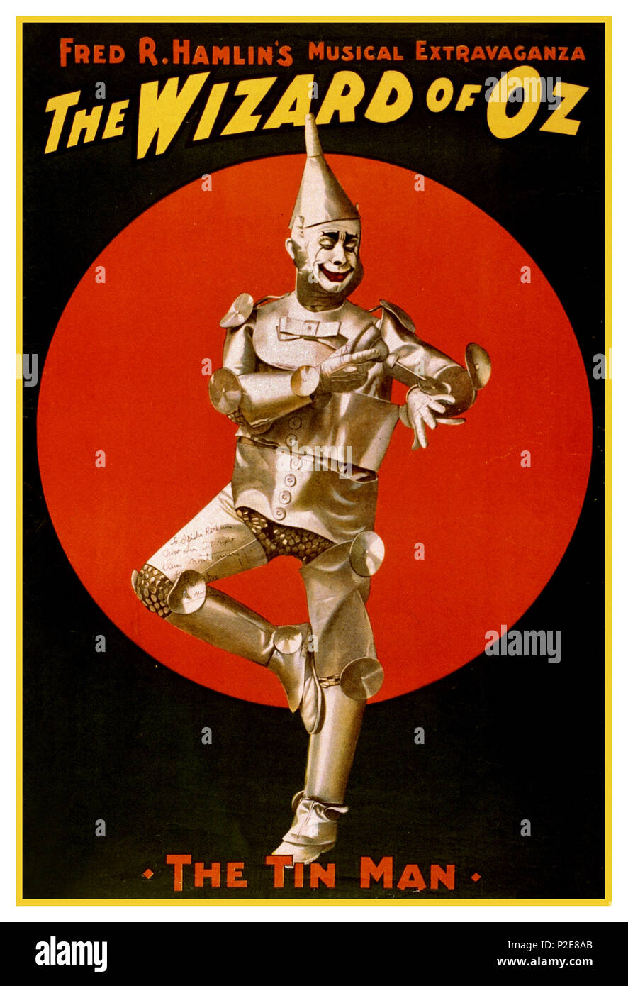 Vintage 1930’s Musical Poster ‘ The Wizard of Oz’  The Tin Man. Poster for Fred R. Hamlin's musical extravaganza, The Wizard of Oz. Poster print, lithograph, Created by 'The U.S. Lithograph Co.' Dave Montgomery by Fred Stone. (David C. Montgomery played Tin Man) Jan. 14, 1936 The Wizard of Oz: An American Fairy Tale. Stock Photo