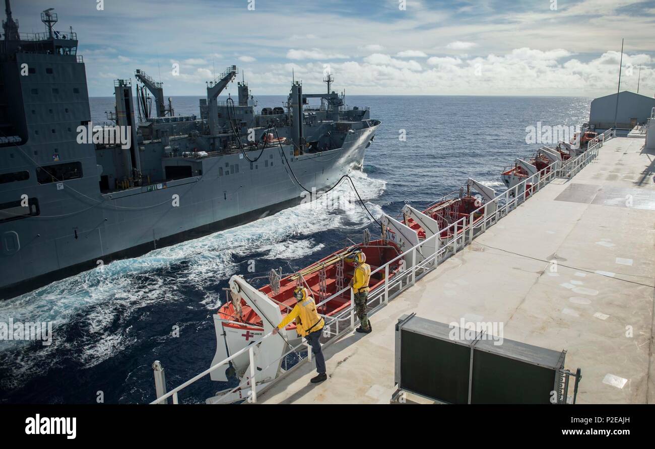 160910-N-QW941-045 PACIFIC OCEAN (Sept. 10, 2016) Dry cargo ship USNS Matthew Perry (T-AKE 9), refuels hospital ship USNS Mercy (T-AH 19) during a replenishment at sea. Deployed in support of Pacific Partnership 2016, Mercy is sailing to her homeport of San Diego. (U.S. Navy photo by Mass Communication Specialist 3rd Class Trevor Kohlrus/Released) Stock Photo