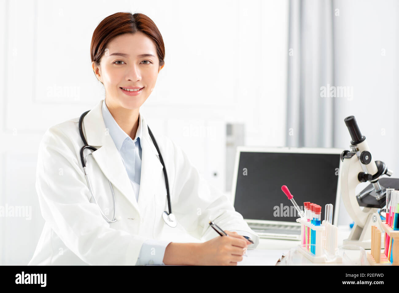 female medical or scientific researcher working in office Stock Photo