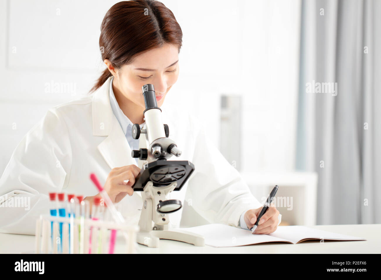 female medical or scientific researcher working in lab Stock Photo