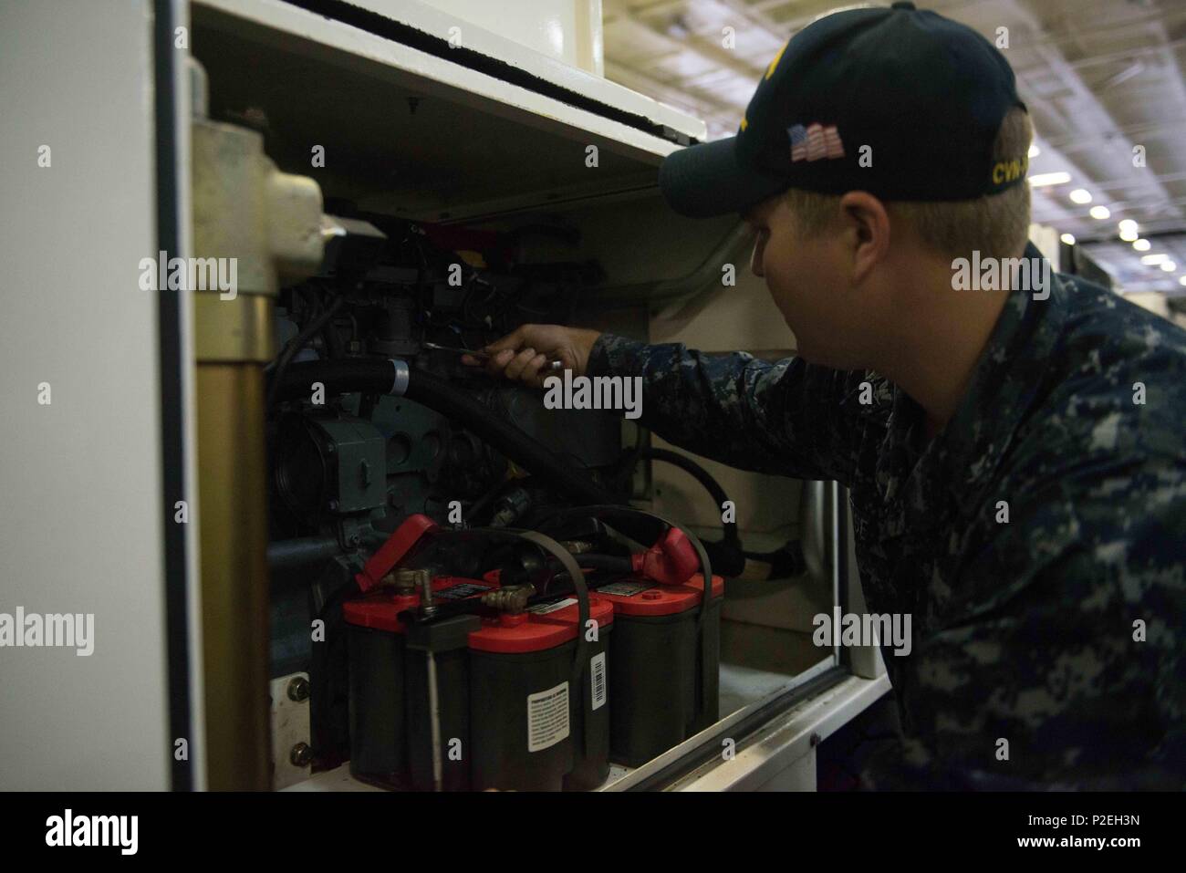 160908-N-EN247-111: BREMERTON, Washington (Sept. 8, 2016) Aviation Support Equipment Technician 3rd Class Jackson Wise, from Blountville, Tennessee,works on a hydraulic power supply in USS John C. Stennis' (CVN 74) hangar bay. John C. Stennis is conducting a routine maintenance availability following a deployment to U.S. 7th and 3rd fleet areas of operation. (U.S. Navy photo by Mass Communication Specialist Seaman Alexander P. Akre / Released) Stock Photo