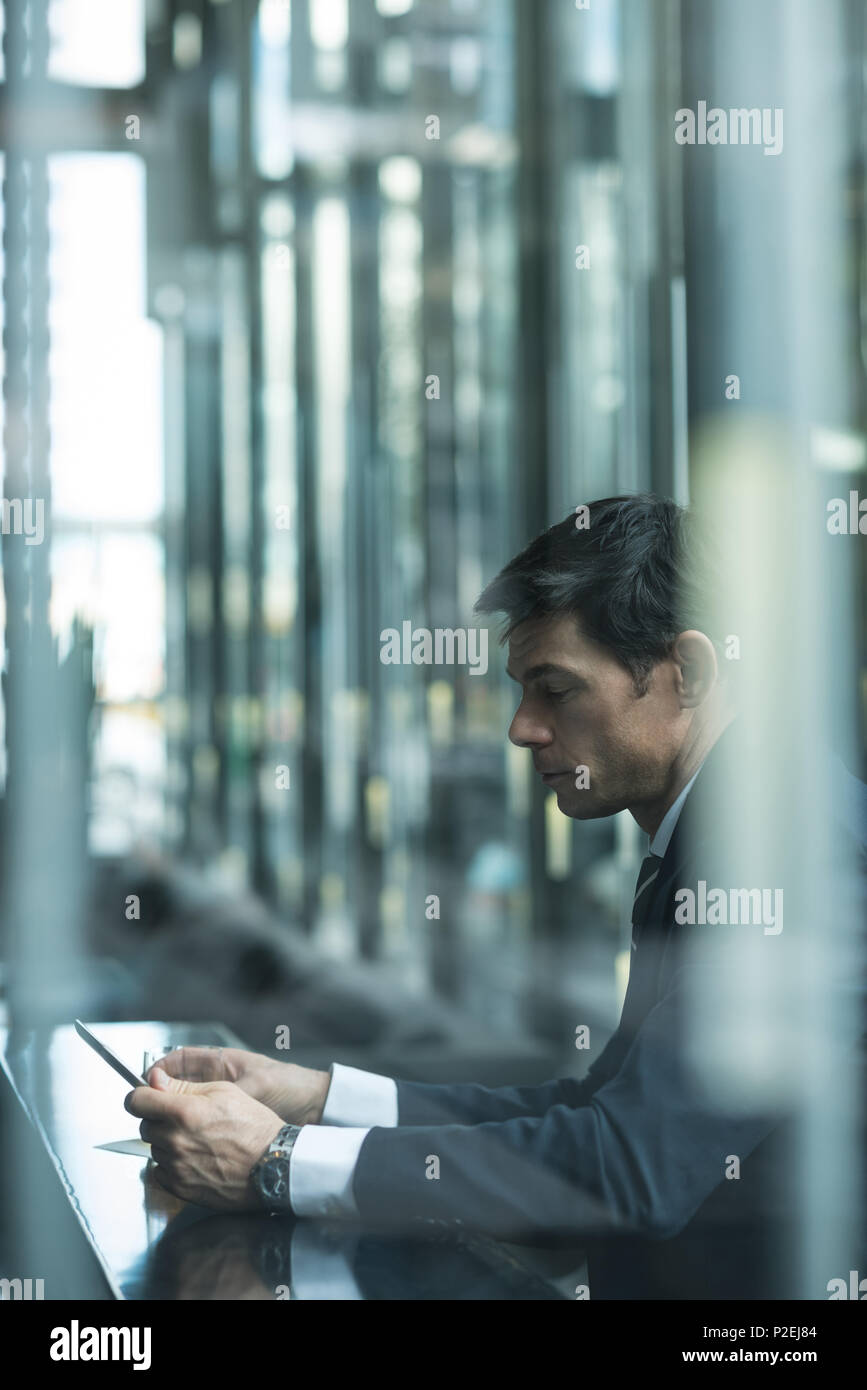 Businessman using mobile phone Stock Photo