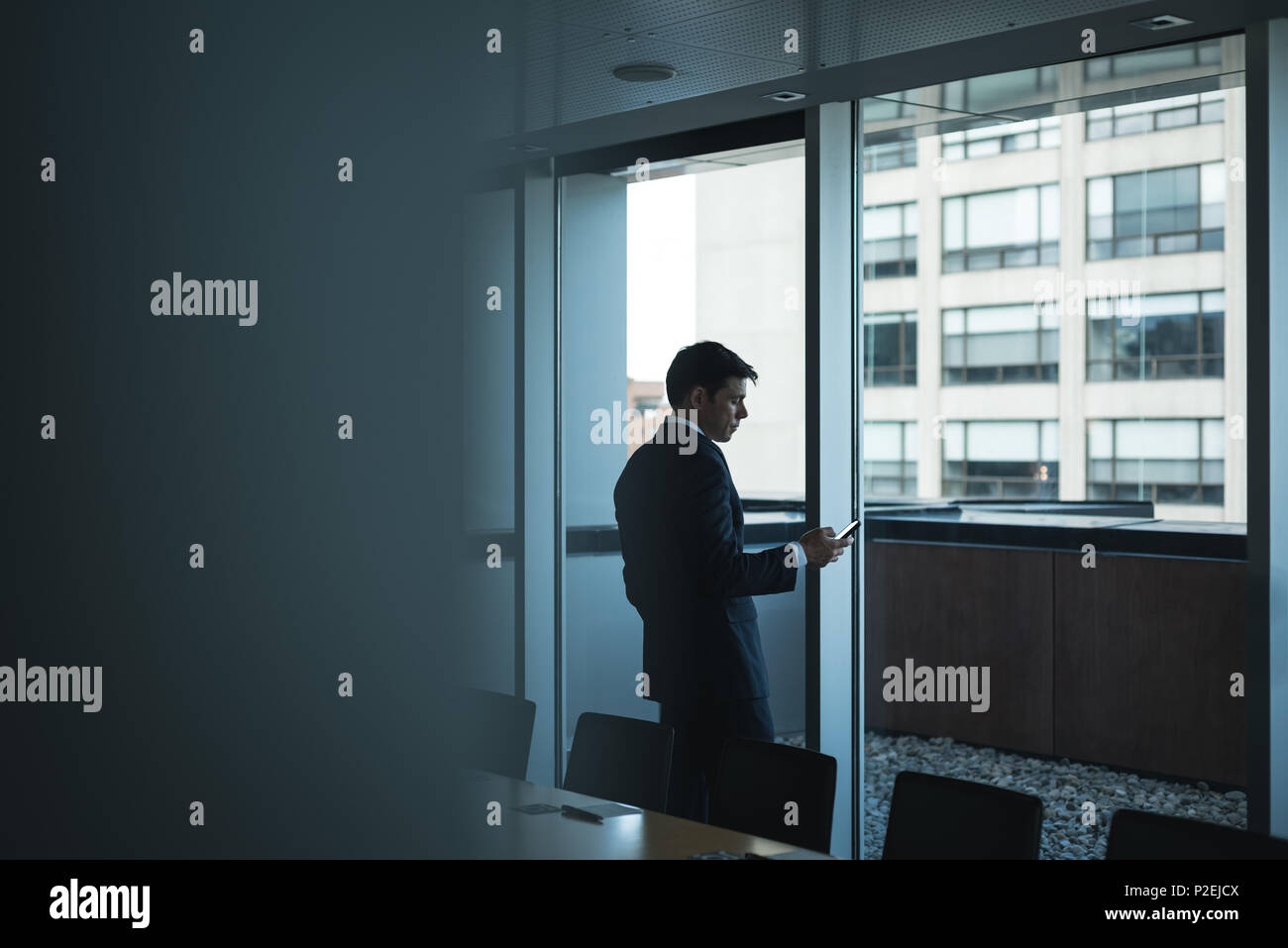 Businessman using mobile phone Stock Photo