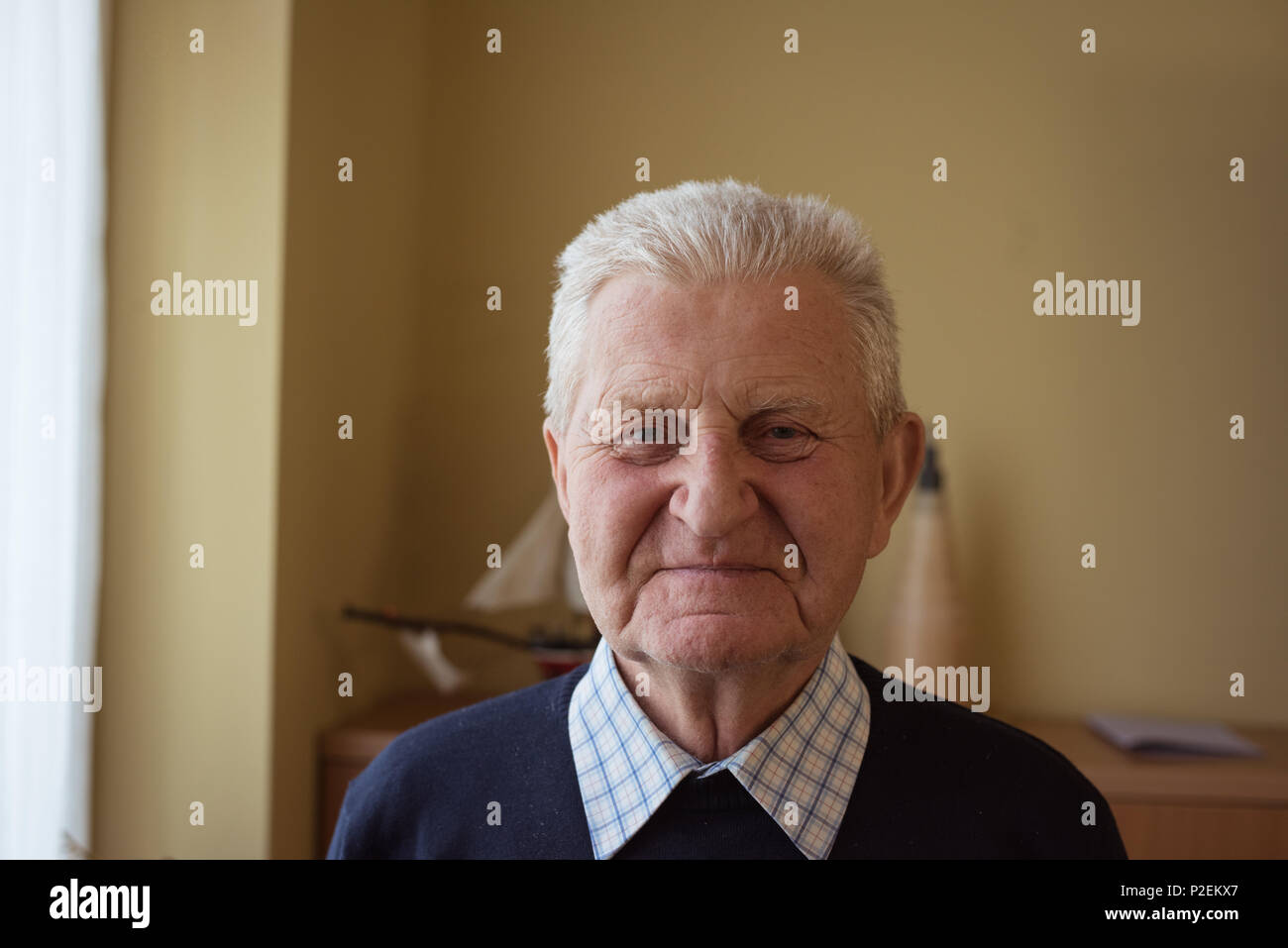 Senior man looking at camera Stock Photo