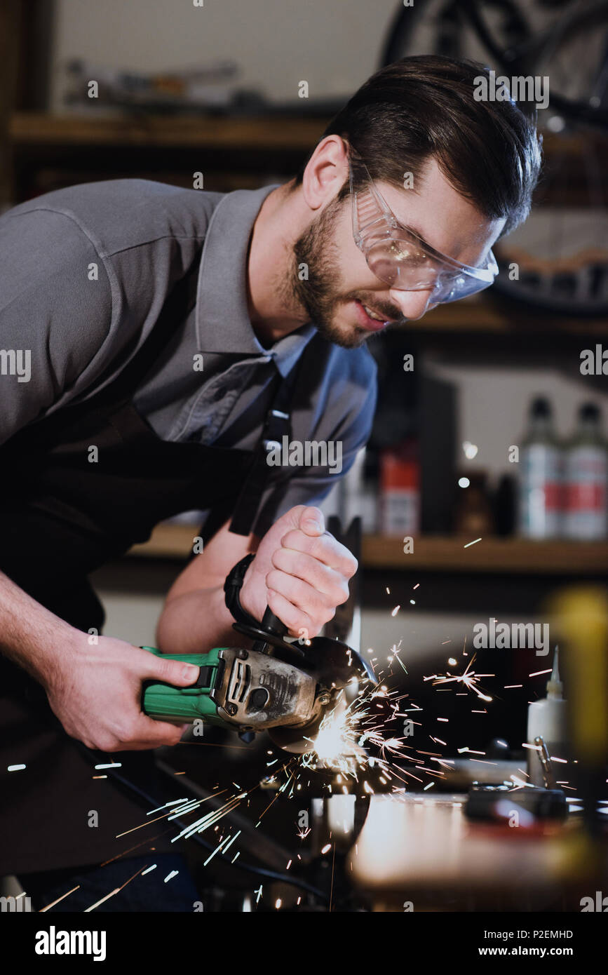 Man holding angle grinder hi-res stock photography and images - Alamy
