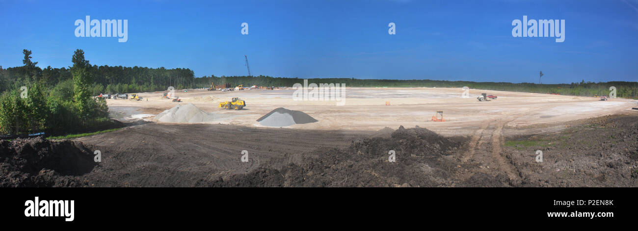 A panoramic view, formed from multiple photos, depicts the site of a new raw water storage impoundment under construction in Effingham County, Georgia. The water impoundment will hold enough raw water to replace two days of water normally withdrawn from the Savannah River by the City of Savannah’s water department. The impoundment, part of the Savannah Harbor Expansion Project (SHEP), will be used to replace river water on those rare occasions when high tides and low river flow might allow water with higher chlorine levels to reach the river intakes for the Savannah water system for a few hour Stock Photo