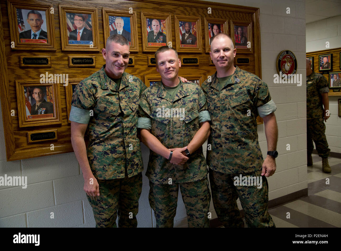 From left to right, U.S. Marine Brig. Gen. Jason Q. Bohm, Commanding General, Training Command, Sgt. James Lentz, instructor, Field Medical Training Battalion-East,  and Sgt. Maj. Jeffrey Monssen, Sergeant Major, Training Command, pose for a photo during a scheduled visit onboard Camp Johnson, N.C., Sept. 8, 2016. Brig. Gen. Bohm visited Marine Corps Combat Service Support School to receive information concerning current school initiatives, operations and advocacy. (U.S. Marine Corps photo by Cpl. Andrew M. Kuppers) Stock Photo