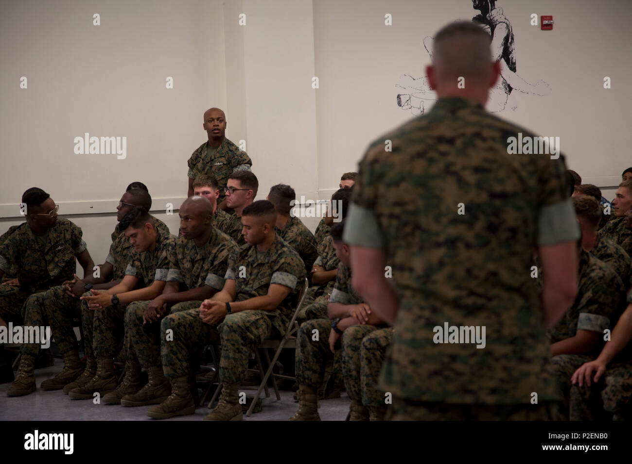 U.S. Marine Brig. Gen. Jason Q. Bohm, Commanding General, Training Command, addresses a U.S. Navy Corpsman with the Field Medical Training Battalion-East, Marine Corps Combat Service Support School (MCCSSS) during a scheduled visit onboard Camp Johnson, N.C., Sept. 8, 2016. Brig. Gen. Bohm visited MCCSSS to receive information concerning current school initiatives, operations and advocacy. (U.S. Marine Corps photo by Cpl. Andrew M. Kuppers) Stock Photo