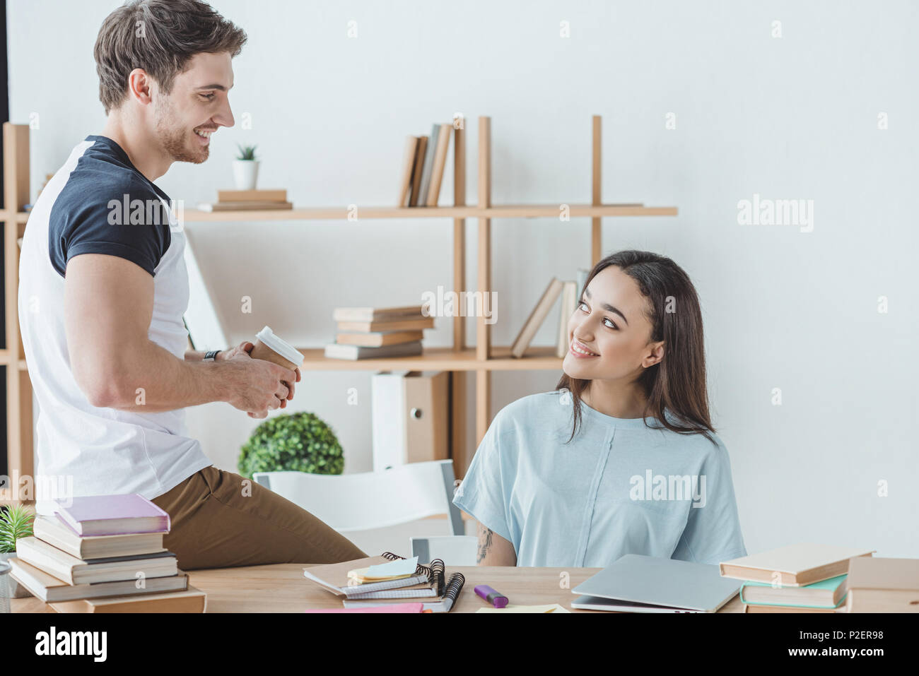 couple of smiling multiethnic students studying together Stock Photo ...