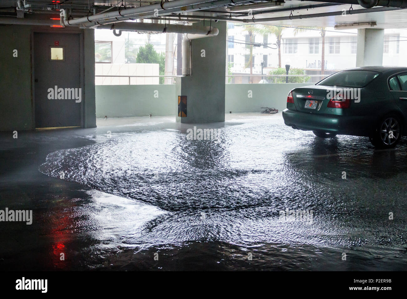 Miami Beach Florida,covered garage,during Hurricane Irma,tropical storm force winds,rain,flooded parking garage,FL170911051 Stock Photo