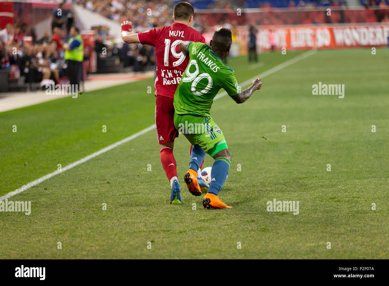 Harrison, United States. 13th June, 2018. Alex Muyl (19) of Red Bulls & Waylon Francis (90) of Seattle Sounders fight for ball during regular MLS game at Red Bull Arena Red Bulls won 2 -1 Credit: Lev Radin/Pacific Press/Alamy Live News Stock Photo