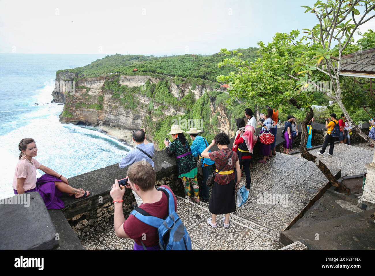 Tourists visiting Pura Uluwatu Temple, Uluwatu, Bali, Indonesia Stock ...