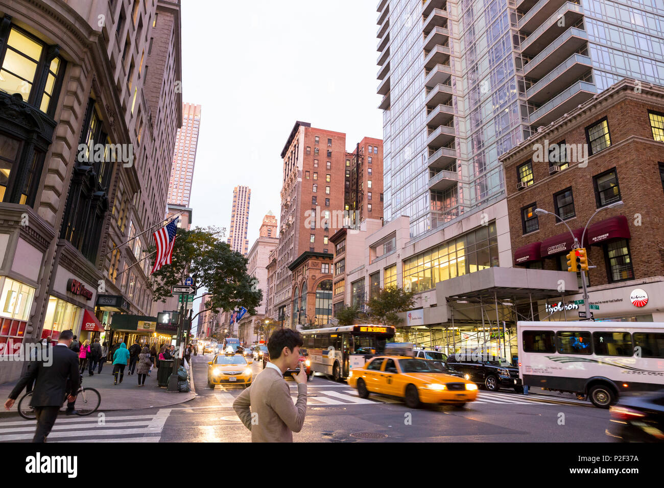 5th Avenue, E 32 Street, street corner, man smoking, yellow cab, taxi ...