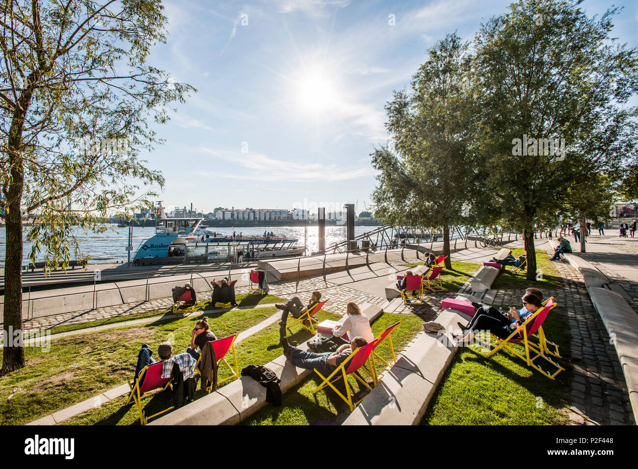 people chilling at the Dalmannkai in the Hafencity of Hamburg, north Germany, Germany Stock Photo